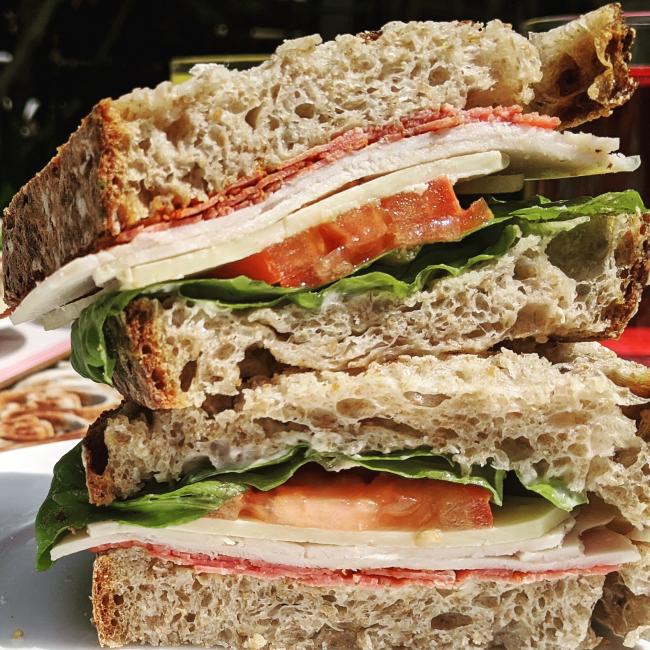 Pastrami and turkey sandwich on sourdough bread